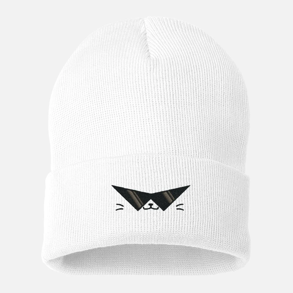 White knit beanie with the Sealed mascot embroidered in black.